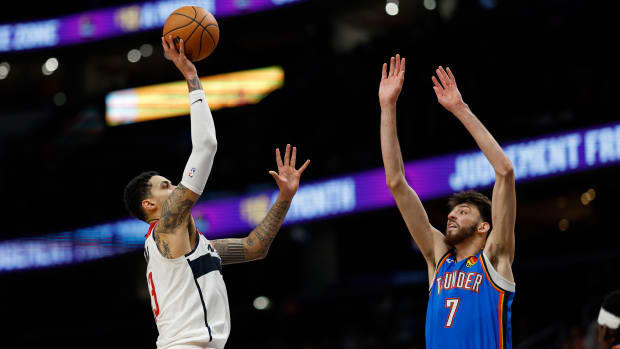 Washington Wizards forward Kyle Kuzma (33) shoots the ball over Oklahoma City Thunder forward Chet Holmgren (7) in the fourth quarter at Capital One Arena. 